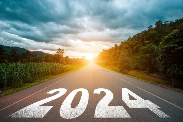 new year 2024 concept text 2024 written on the road in the middle of asphalt road with at